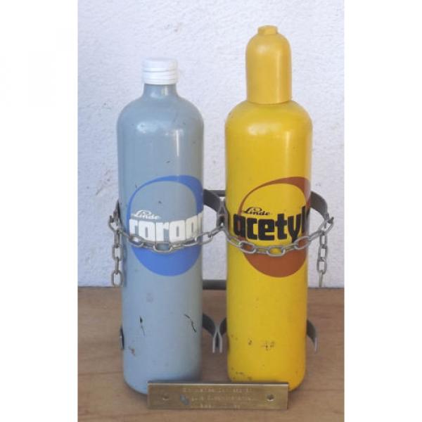 Linde Acetylene/Corgon Schnapps bottles on hand trucks - Decorational object #1 image